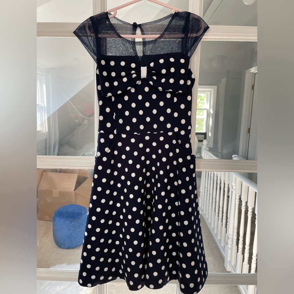 Rare editions. Brand new real cute polka dot dress with pockets. Size: girl 7-8.